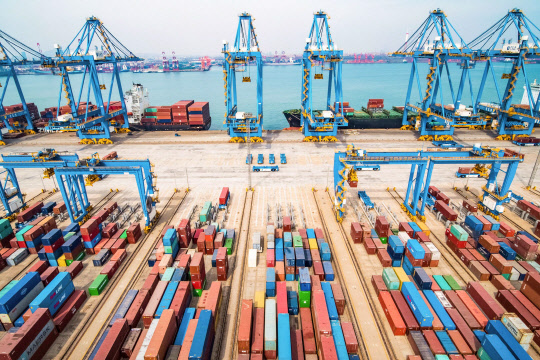 An aerial view of a port in Qingdao in China's eastern Shandong province on March 8, 2019. - China's exports and imports plummeted much more than expected in February, official data showed on March 8, adding to worries about slowing growth in the world's number two economy as it fights a trade war with the US. (Photo by STR / AFP) / China OUT